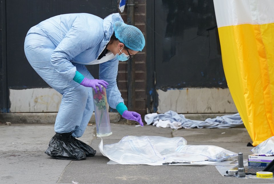 Forensic teams at the scene of the tragedy