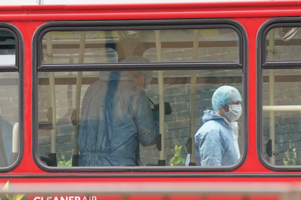 Police forensics officers on No60 bus yesterday after the horror stabbing