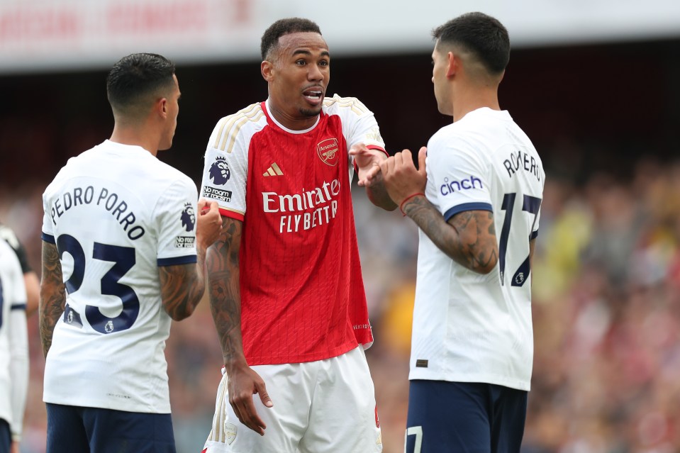 Arsenal's Gabriel Magalhaes discusses the penalty with Spurs' Cristian Romero