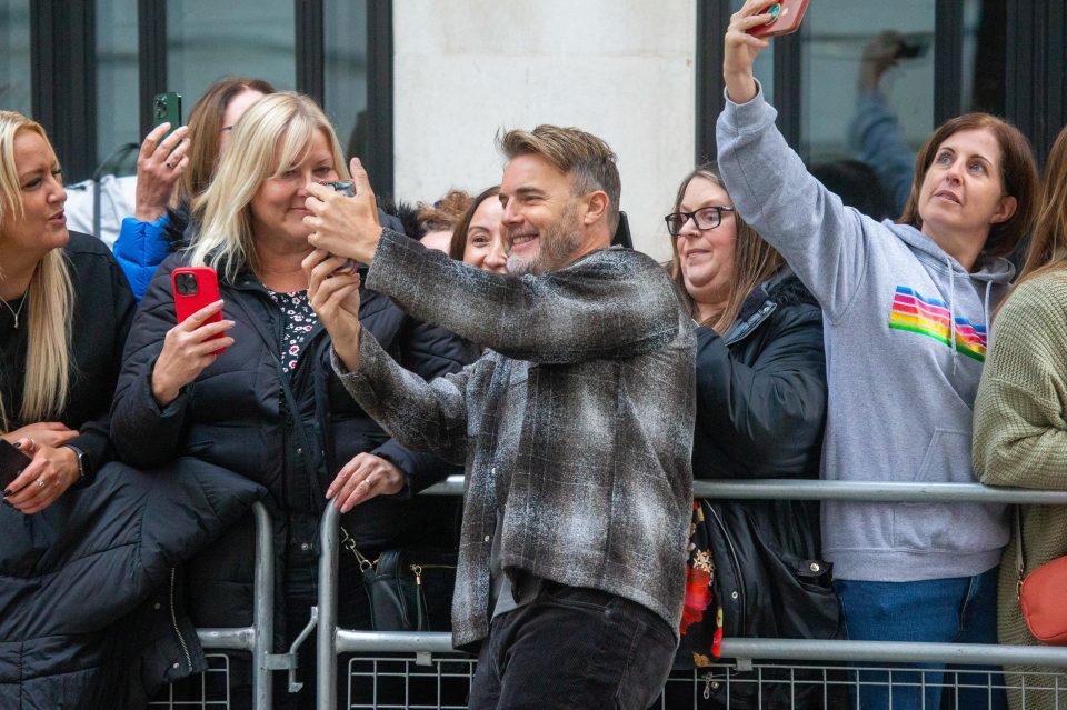 There was something close to ­hysteria as Gary Barlow, Mark Owen and Howard Donald paused to take some snaps with Take That fans after appearing on Zoe Ball’s breakfast show