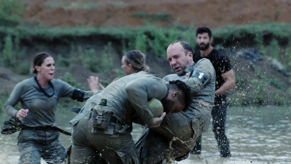 Matt Hancock grimaces as he is bundled over while wrestling on Celebrity SAS: Who Dares Wins