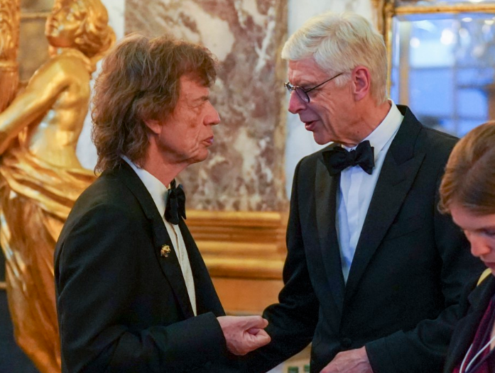 Former Arsenal gaffer Arsene Wenger chats with Mick Jagger at the convention