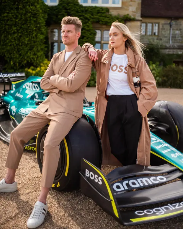 Jessica, pictured with Haas driver Nico Hulkenberg, is a regular sight around the F1 paddock