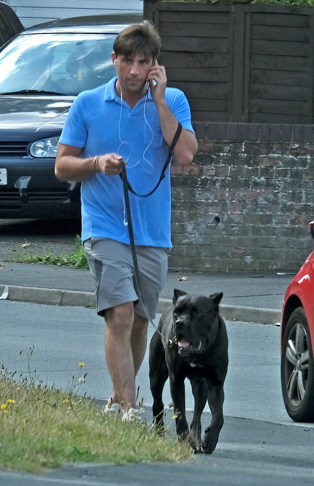 Jack Fincham looked downcast as he walked his dog