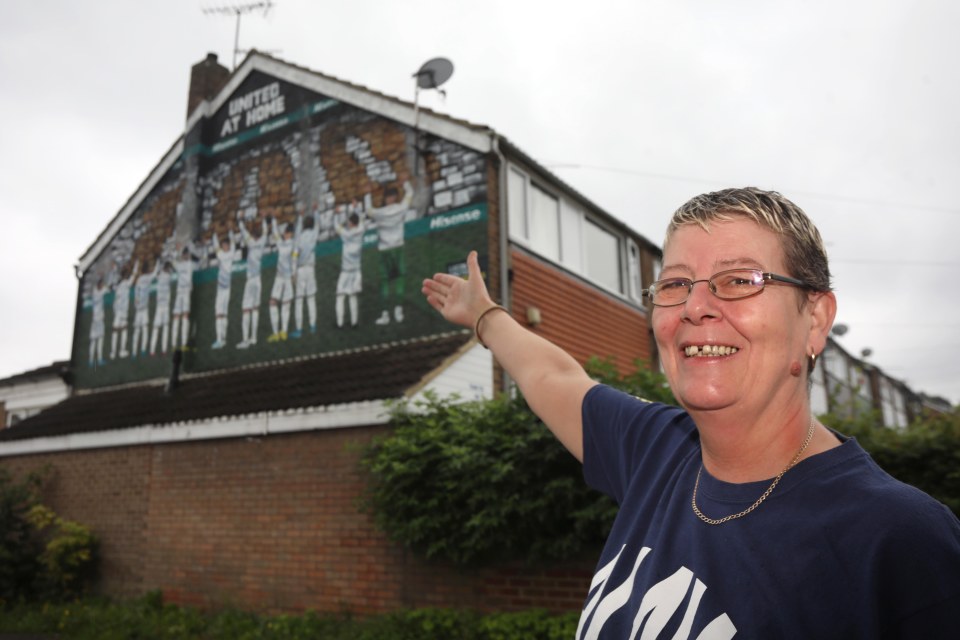 Another superfan who lives in the road, Julie Ridings has a mural painted on her home dedicated to the club