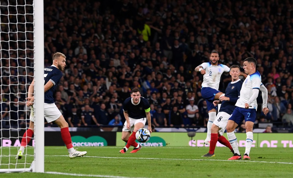 Phil Foden watches his opener in the friendly at Hampden Park