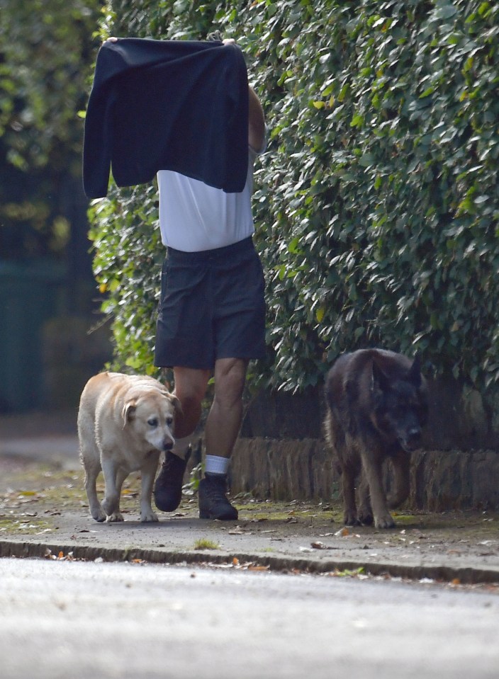 Keane was flanked by his dogs as he headed out for a walk this morning