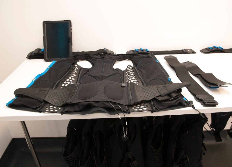 The fitness suit is sprayed with water then wired up to a machine