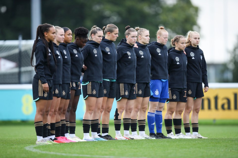 Players of England and Germany observe a minute of silence in tribute