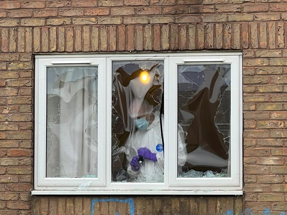 A smashed window at the scene