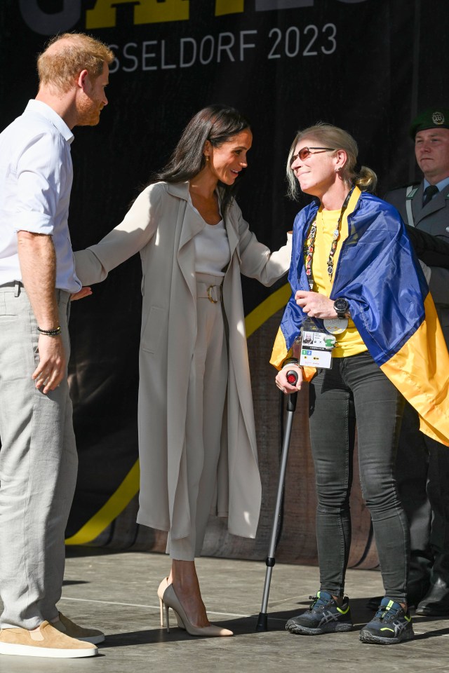 Meg was tasked with presenting athletes, who took part in the swimming, with their medals