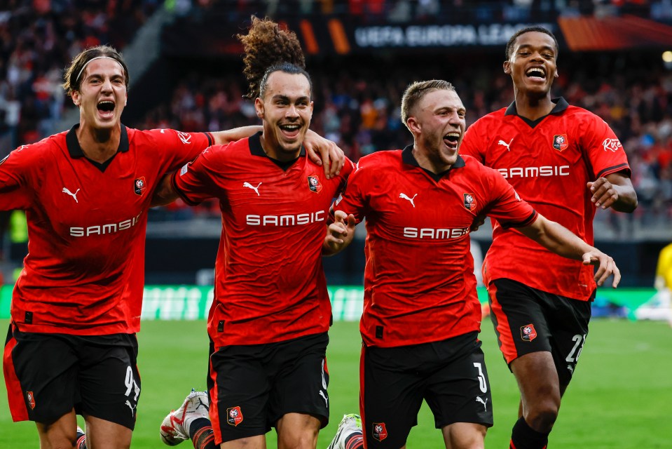 Rennes celebrate after Adrien Truffert, third left, put them 2-0 up