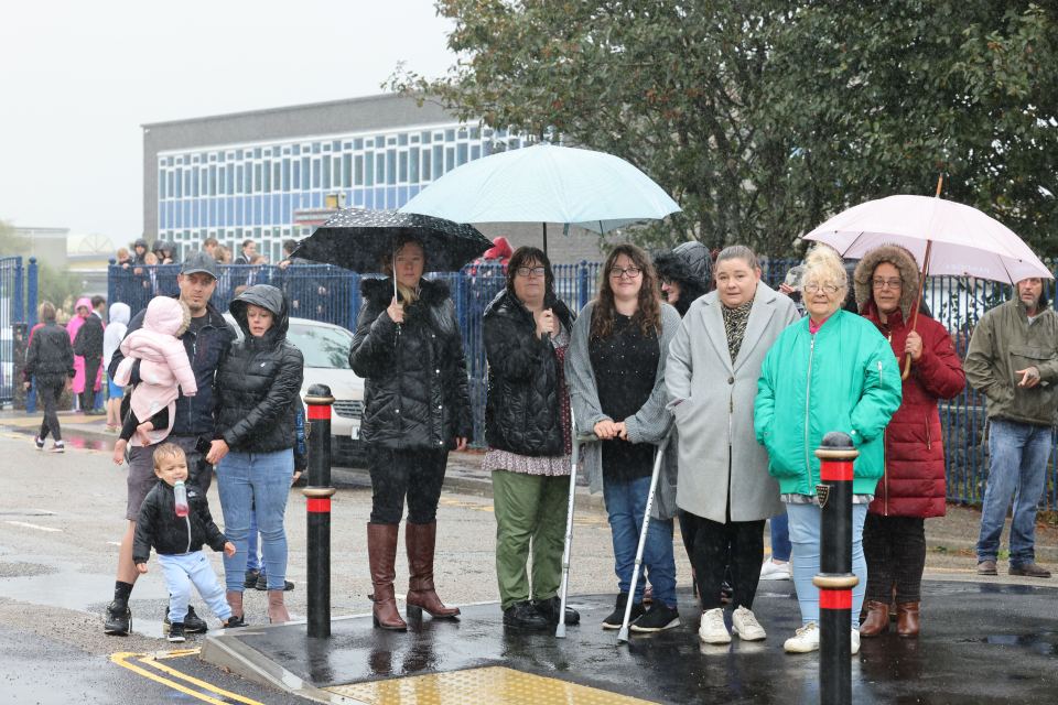 Pupils and parents outside of Camborne Science and International Academy on Wednesday