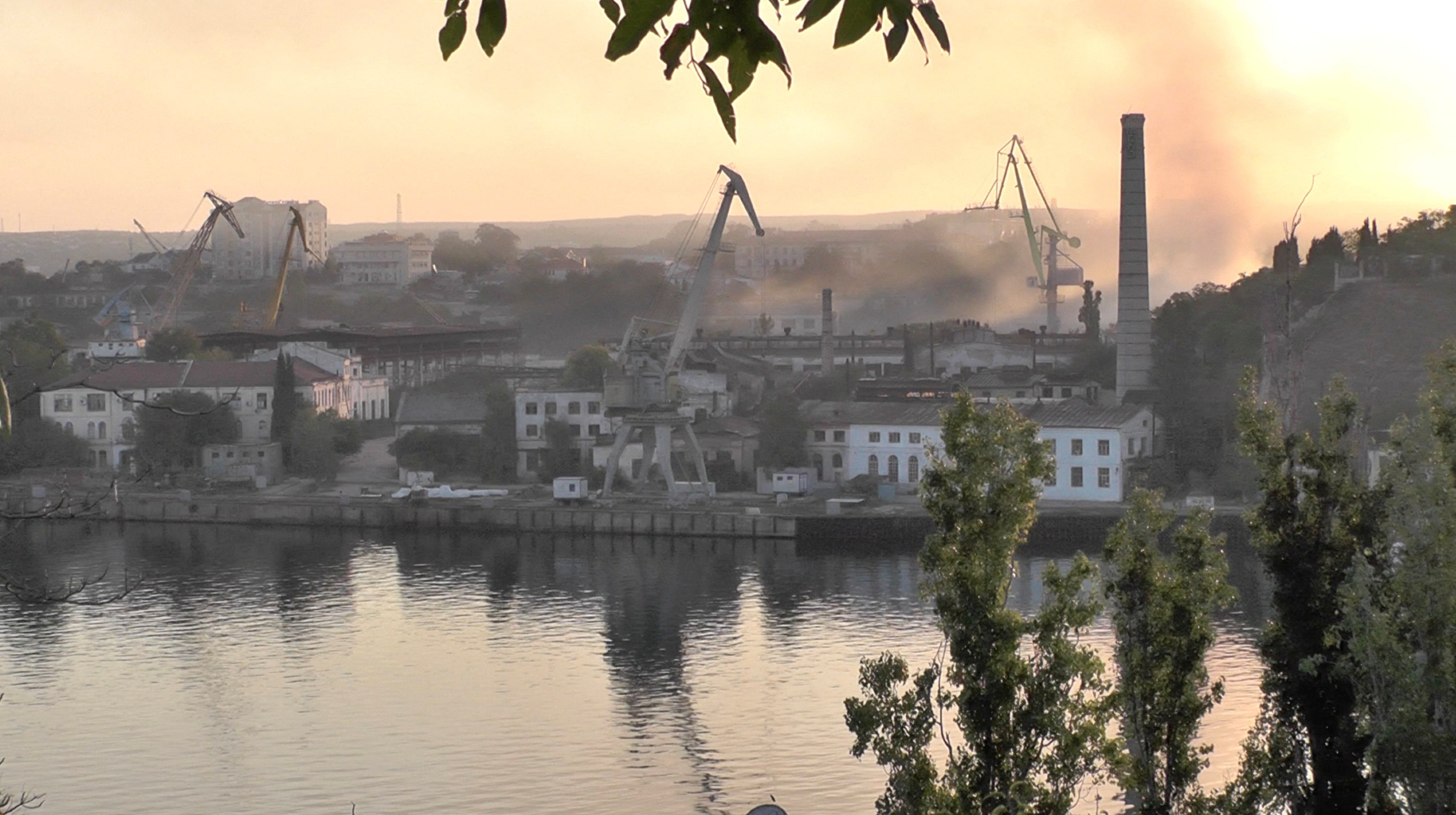 Smoke can be seen in the sky after the strike at the port