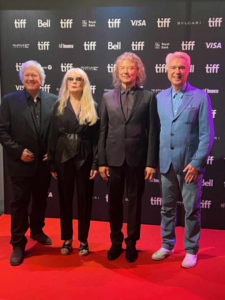 Iconic eighties pop band Talking Heads reunited to pose together for the first time in twenty years, after their bitter split