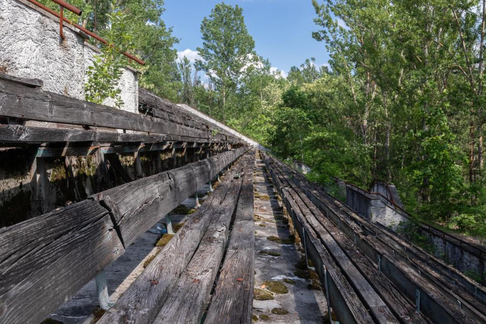 The benches in the stands are worn but still visible