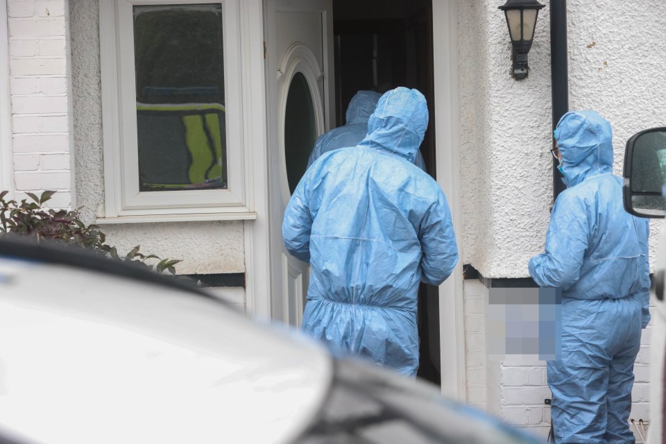 Forensic officers at the scene as a murder probe continues