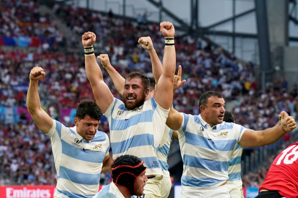 Argentina stars celebrate their late try