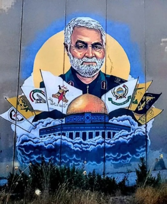 IRGC commander Qassem Soleimani is pictured in a chilling mural on the barrier along with Iran-backed terrorist organisations