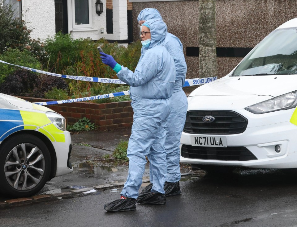 Forensic officers at the scene in Croydon on Monday