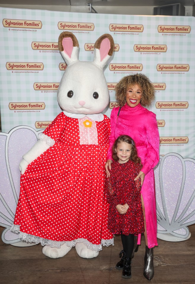 Ria Hebden wore a striking pink fitted dress and brought her daughter Lula along