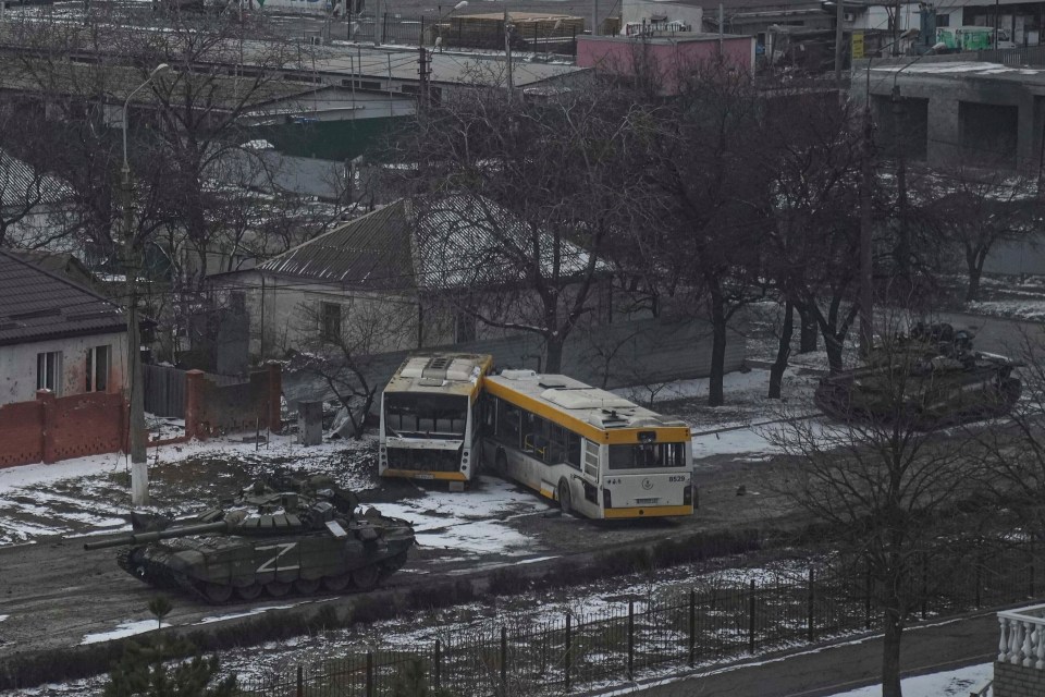 Tanks with the Russian Z markings move along the streets on the edge of Mariupol