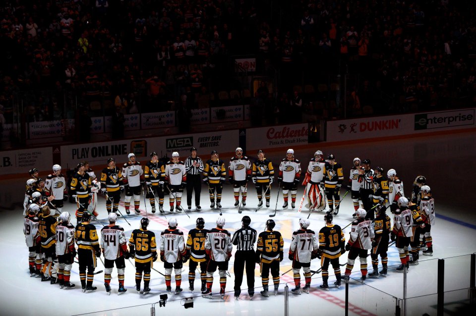 Anaheim Ducks and Pittsburgh Penguins players formed around centre ice to pay tribute to former player Adam on Monday night