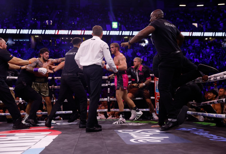 Security rushed the ring to separate the two fighters