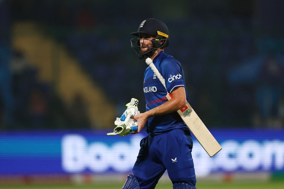 Chris Woakes walks on a miserable day for England