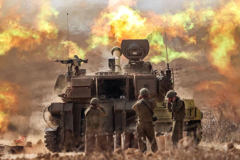 Israeli forces pound artillery near the Gaza border