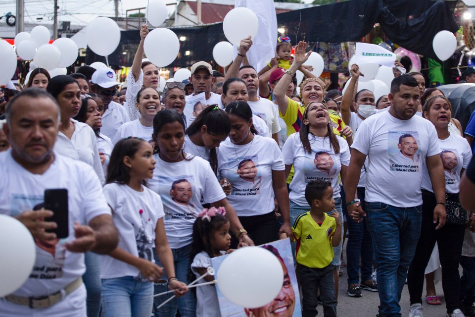 People marching in Barrancas, Colombia, as they demand the release of Diaz's father