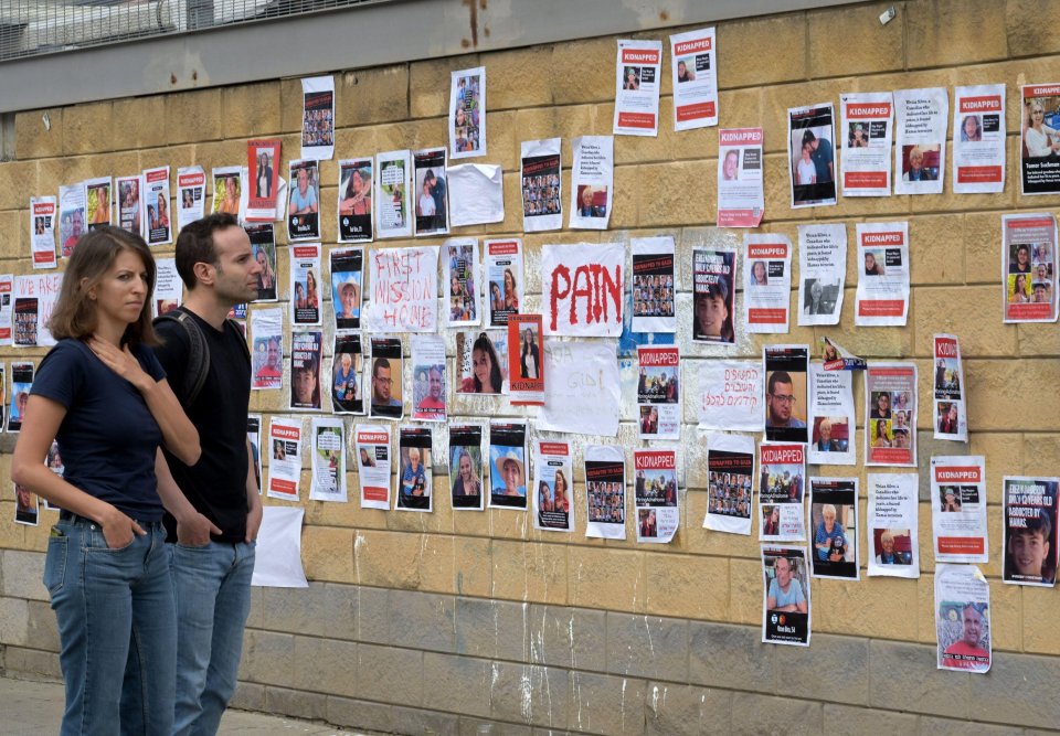 A wall with photos in Tel Aviv shows hostages kidnapped and taken to Gaza