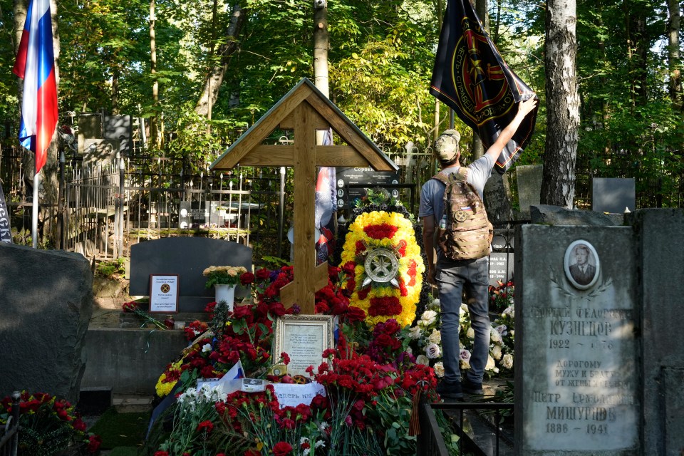 Supporters waved the black flags of Wagner featuring a skull and the motto ‘Blood, Honour, Motherland, Courage’ at the ceremony