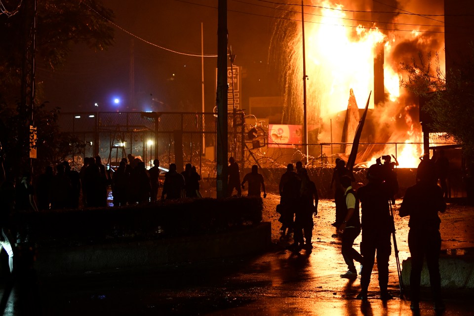 Tear gas was deployed as protesters attacked the embassy building