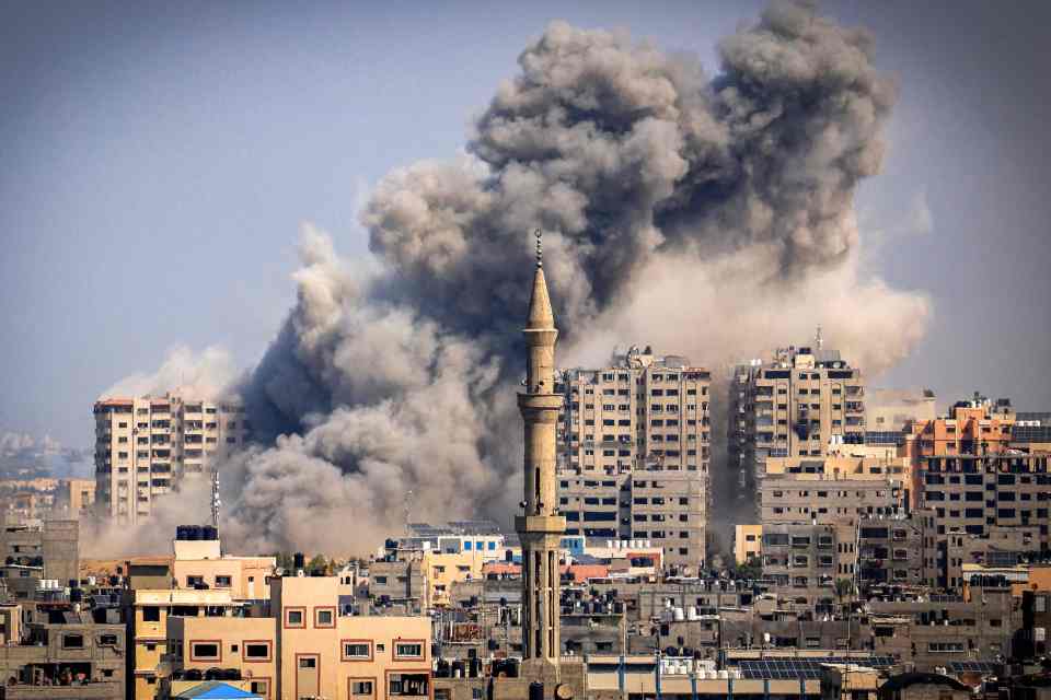 Smoke plumes billow into the sky during Israeli airstrikes in Gaza City