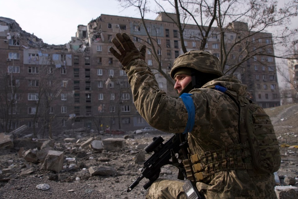 Ukrainian soldier holds his position in the bombed city of Mariupol