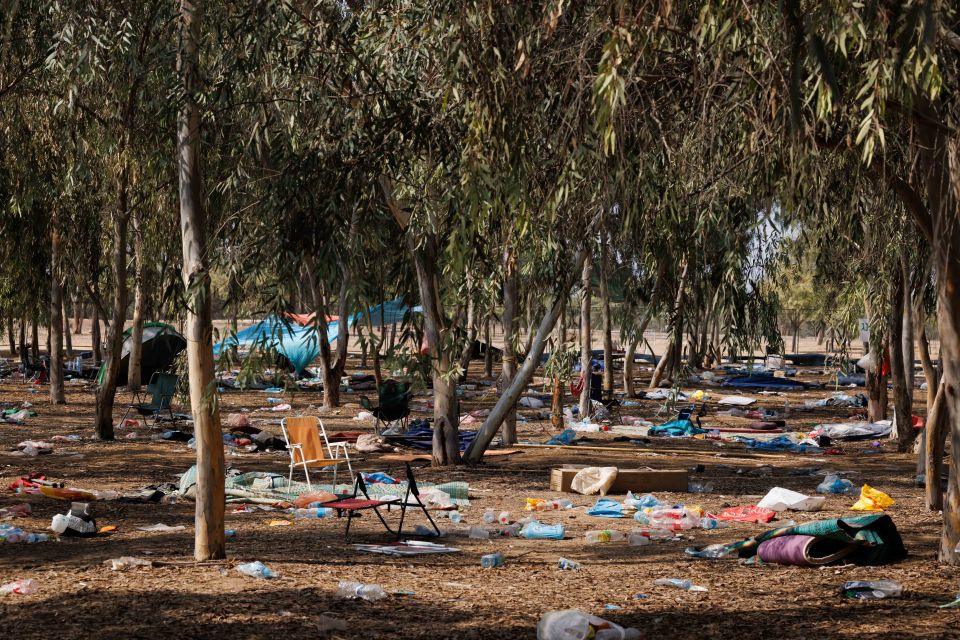 Clothes, belongings and tents were strewn over the desert plains where 260 bodies were found