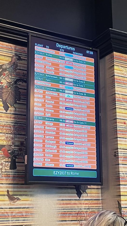 The departures board at Bristol Airport, with most flights badly delayed