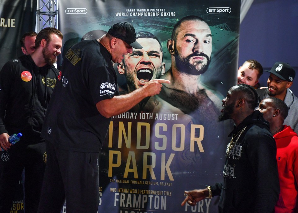 John exchanges words with champ Deontay Wilder during a weigh-in