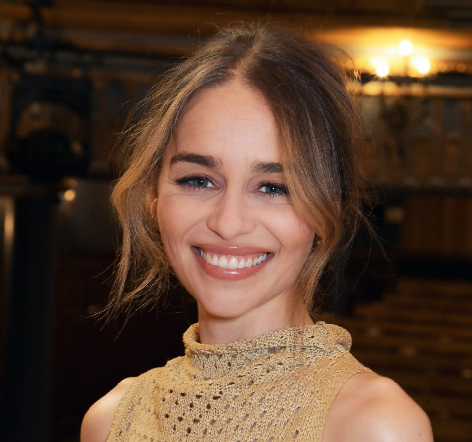 a close up of a woman 's face with a smile on her face