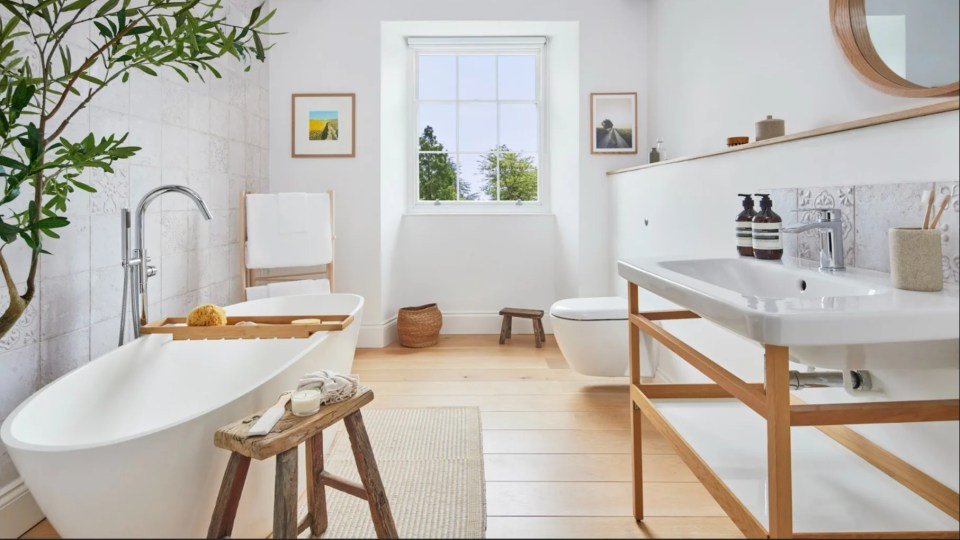 The bathroom is finished with a sleek look