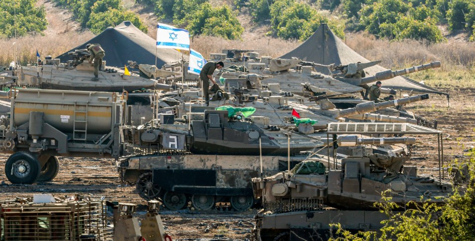 epa10930312 Israeli soldiers and armored vehicles are gathered at an undisclosed location near the border with Gaza, in Israel, 21 October 2023. More than 4,000 Palestinians and 1,400 Israelis have been killed according to the Israel Defense Forces (IDF) and the Palestinian health authority since Hamas militants launched an attack against Israel from the Gaza Strip on 07 October. In the latest developments, Egypt is due to host, on 21 October, an international summit on the situation in Gaza, and after a Qatari mediation, two hostages have been released by Hamas on the evening of 20 October as confirmed by their relatives, Israeli officials and Hamas. EPA/HANNIBAL HANSCHKE