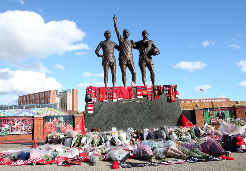 Floral tributes were laid at the Trinity Statue at Old Trafford following the death of Sir Bobby Charlton