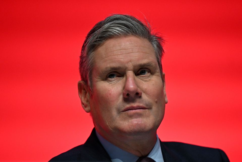 Britain's main opposition Labour Party leader Keir Starmer (R) listens as Britain's main opposition Labour Party deputy leader and Shadow Levelling Up, Housing and Communities Secretary Angela Rayner (unseen) addresses delegates on the first day of the annual Labour Party conference in Liverpool, north west England on October 8, 2023. (Photo by Oli SCARFF / AFP) (Photo by OLI SCARFF/AFP via Getty Images)