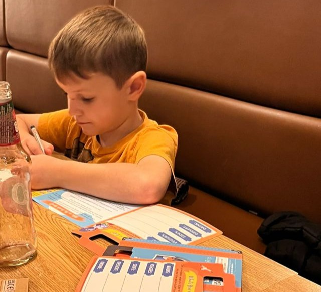 Her son Archie was engrossed in his colouring at the table