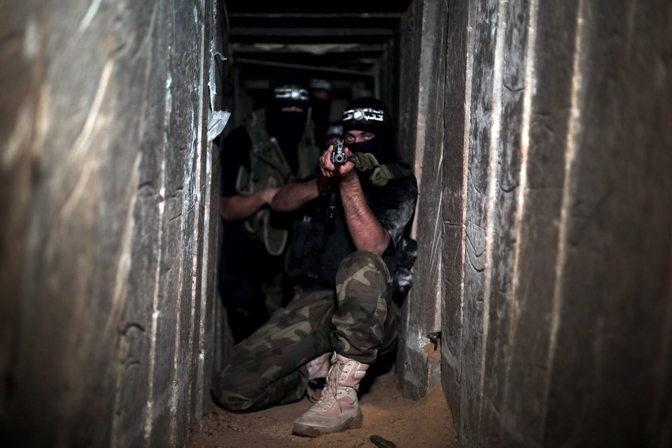 Armed Hamas fighters in one of the underground tunnels in Shujaya neighborhood of Gaza City