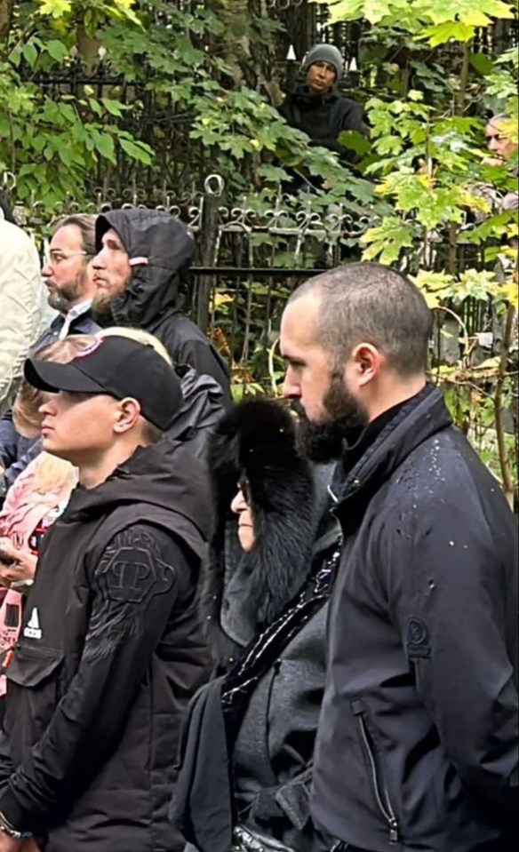 40 days after Prigozhin's death his mother Violetta (centre) and son Pavel (right) went to pay their respects at his St Petersburg grave