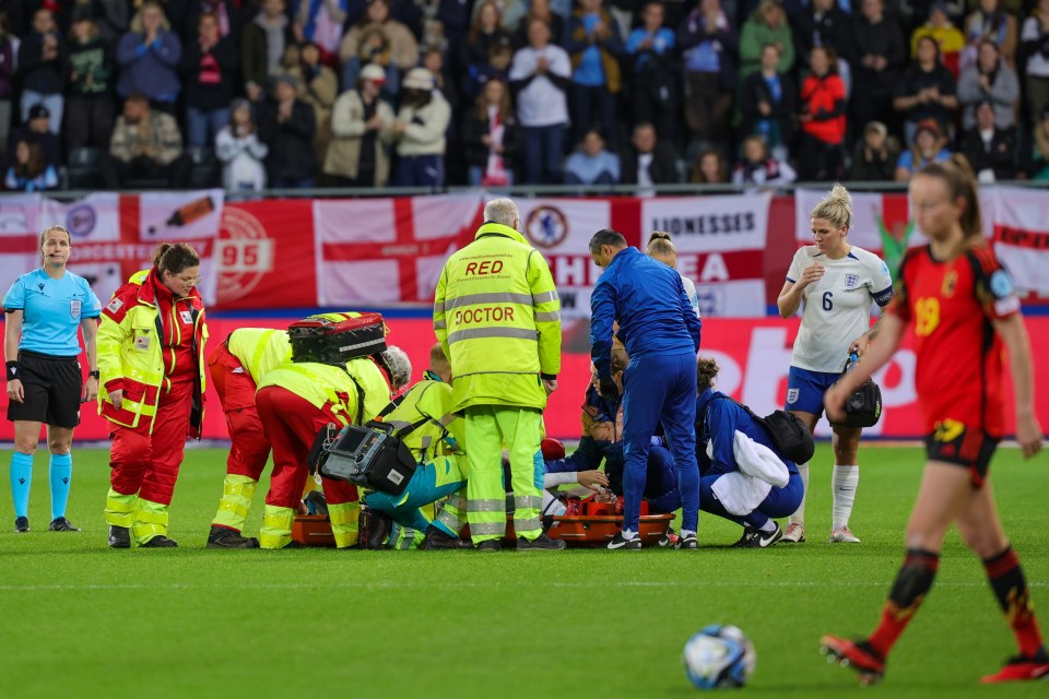 The defender was stretchered off in a neck brace