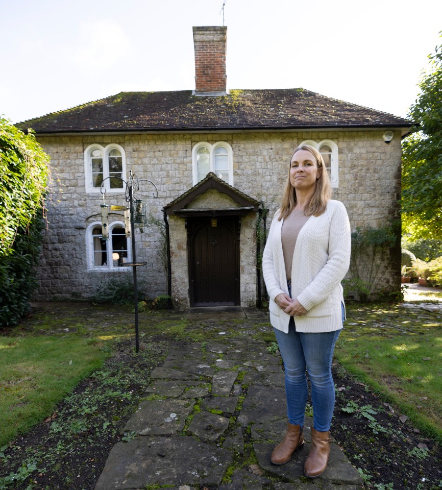 Resident Marie Bettinelli stands in front of her home, Rose Court, a haunted location in Pluckley