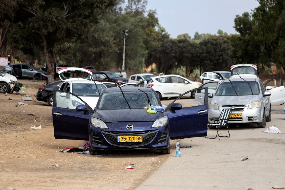 Abandoned cars and scattered belongings litter the road  after the deadly terror attack on Israel